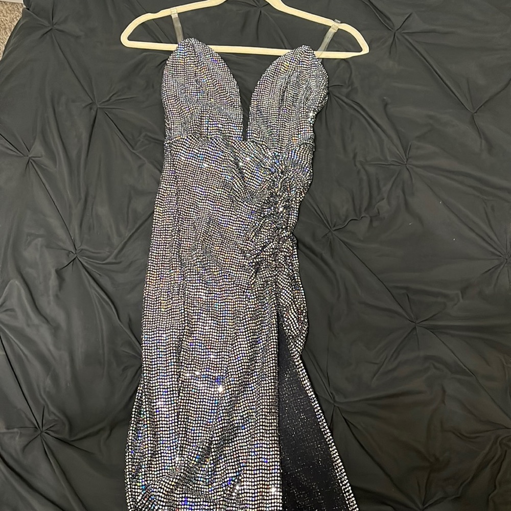 Fitted Black sequins dress with slit.In the video you’ll see the straps are gone